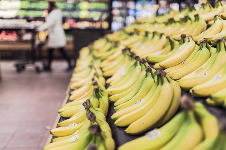 ripe bananas in grocery aisle