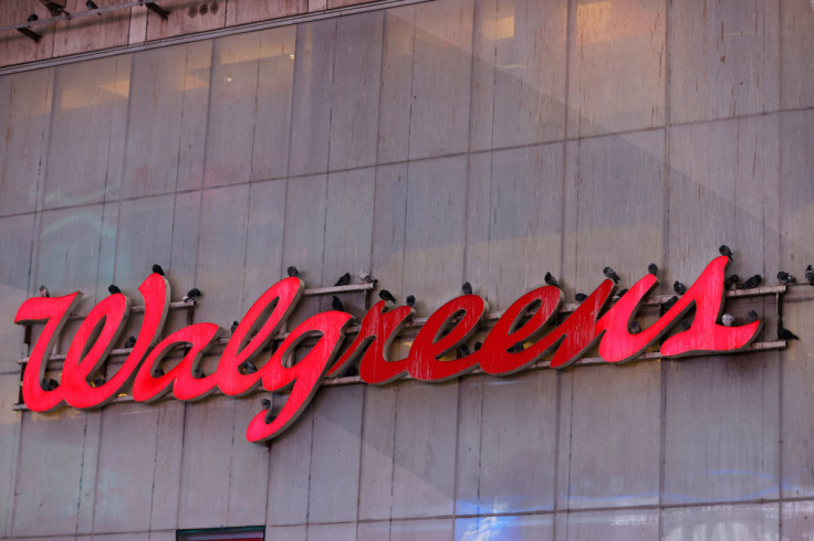 Pigeons are seen resting on signage for Walgreens, owned by the Walgreens Boots Alliance, Inc., in Manhattan, New York City
