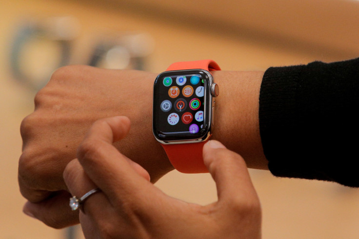 An Apple Store employee shows the Series 5 Apple Watch in New York