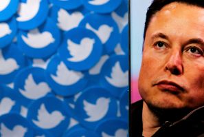Illustration shows Elon Musk image on smartphone and printed Twitter logos