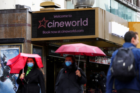 People walk past a Cineworld in Leicester Square in London