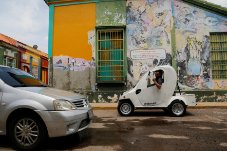 In Venezuelan oil town, solar-powered car offers escape from fuel lines