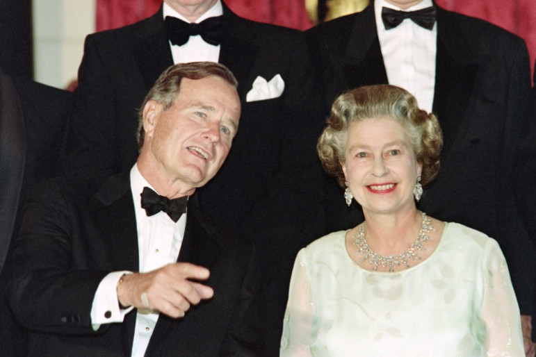 George H.W. Bush, seen here with Queen Elizabeth II at a NATO summit in London in 1990, took the monarch to a baseball game in Baltimore