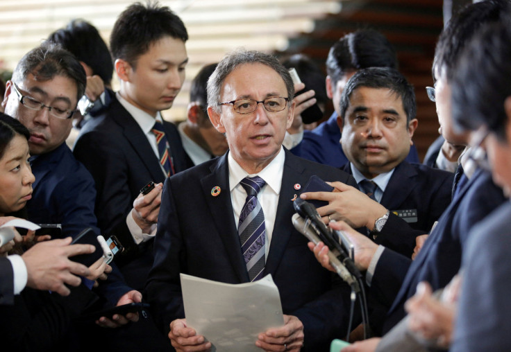 Okinawa Governor Denny Tamaki speaks to media after a meeting with Japanese Prime Minister Shinzo Abe in Tokyo