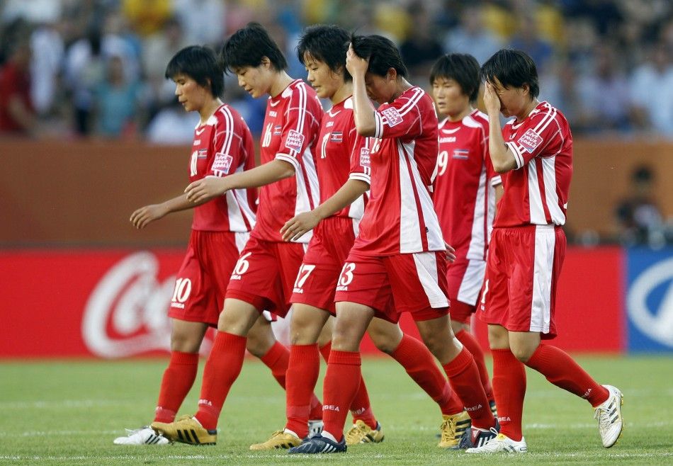 Players of North Korea leave the pitch after being defeated by the U.S. during their Womens World Cup Group C soccer match in Dresden June 28, 2011.  