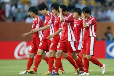 Players of North Korea leave the pitch after being defeated by the U.S. during their Women's World Cup Group C soccer match in Dresden June 28, 2011.  