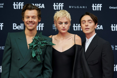 Harry Styles (L) stars in 'My Policeman' as a gay policeman caught in a forbidden love triangle with a young woman, played by Emma Corrin (C), and an art gallery curator, played by David Dawson, in 1950s Britain