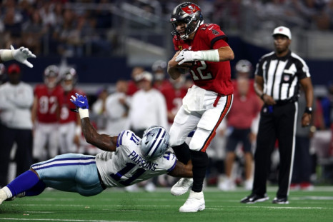 Micah Parsons of the Dallas Cowboys sacks Tampa Bay quarterback Tom Brady in the Buccaneers' 19-3 NFL victory over the Cowboys