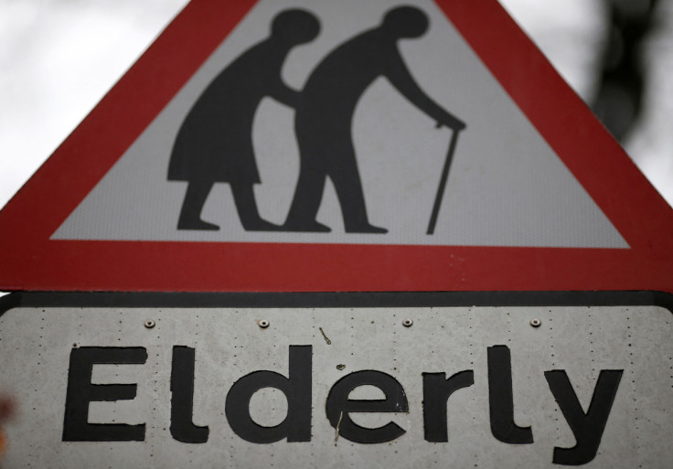 A road sign warning drivers of elderly people crossing the road