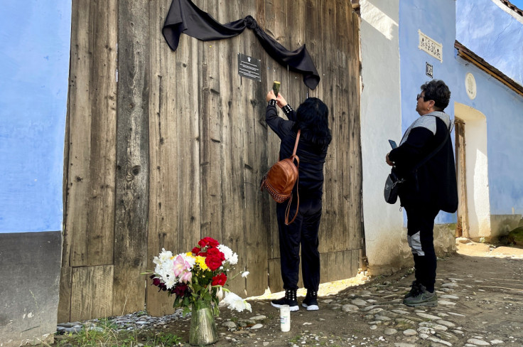 Tourists visit the 18th century cottage owned by Britain's King Charles in the Transylvanian village of Viscri