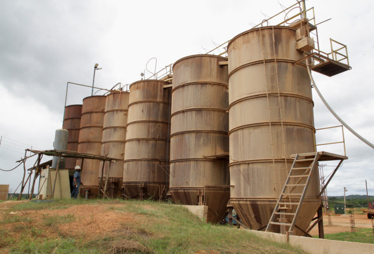 Wokers process sand at a gold mill, in El Callao