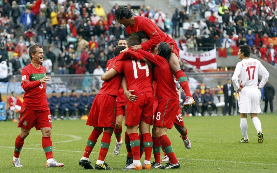 Portugal players celebrate a goal against North Korea during the 2010 World Cup group G soccer match at Green Point stadium in Cape Town June 21, 2010.