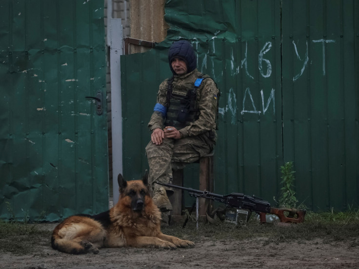Ukrainian serviceman patrols an area, as Russia's attack on Ukraine continues, in the town of Izium