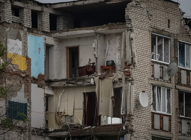 A damaged apartment building is seen in the town of Izium