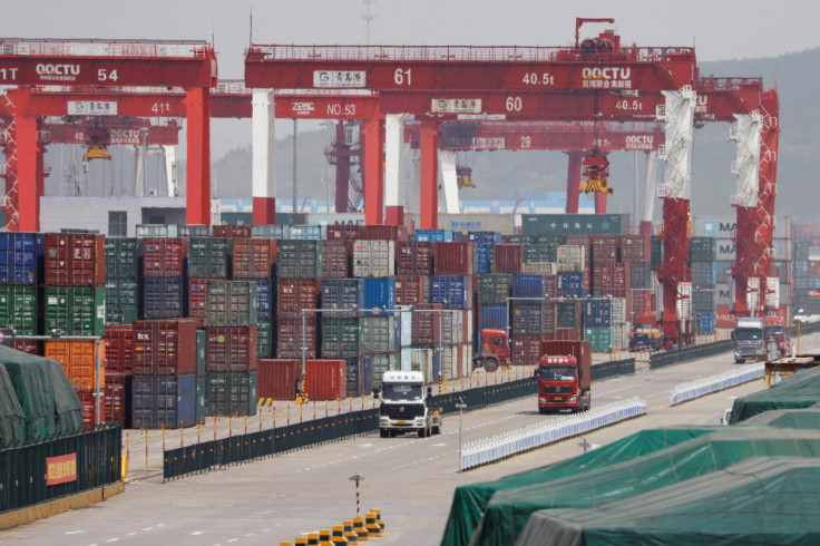 Trucks are seen at a container terminal of Qingdao port