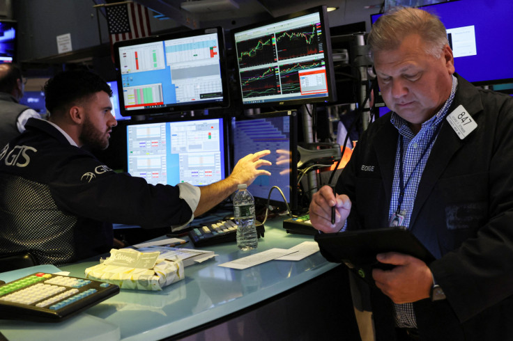 Traders work on the floor of the NYSE in New York