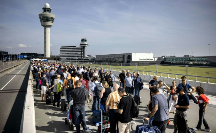 Passengers have had to stand in huge line for hours before catching flights at Amsterdam's Schiphol airport