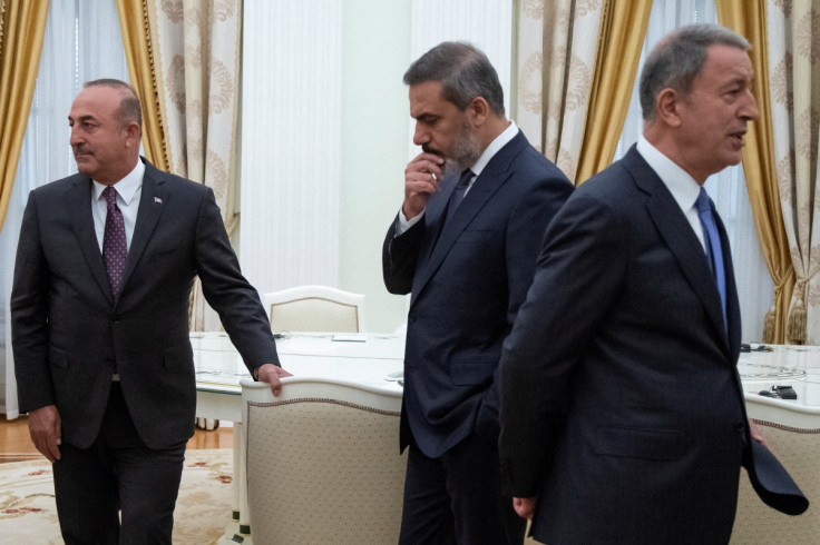 Turkish Foreign Minister Cavusoglu, Defence Minister Akar and intelligence chief Fidan are seen before a meeting with Russian President Vladimir Putin in the Kremlin in Moscow