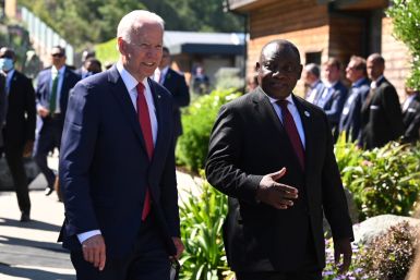 U.S. President Joe Biden talks with South Africa's President Cyril Ramaphosa as they arrive for a working session during G7 summit in Carbis Bay, Cornwal