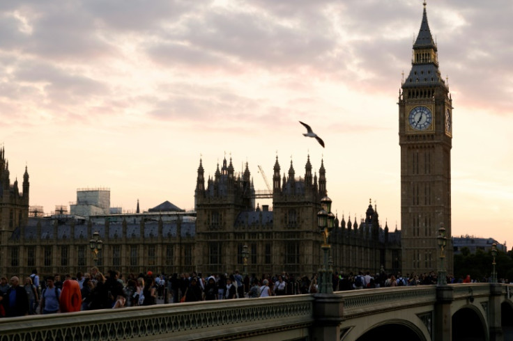 Members of the public queue up along the River Thames to pay their last respects