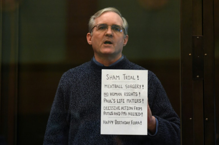 In this file photo taken on June 15, 2020 Paul Whelan, a former US marine accused of espionage, stands inside a defendants' cage as he waits to hear his verdict in Moscow