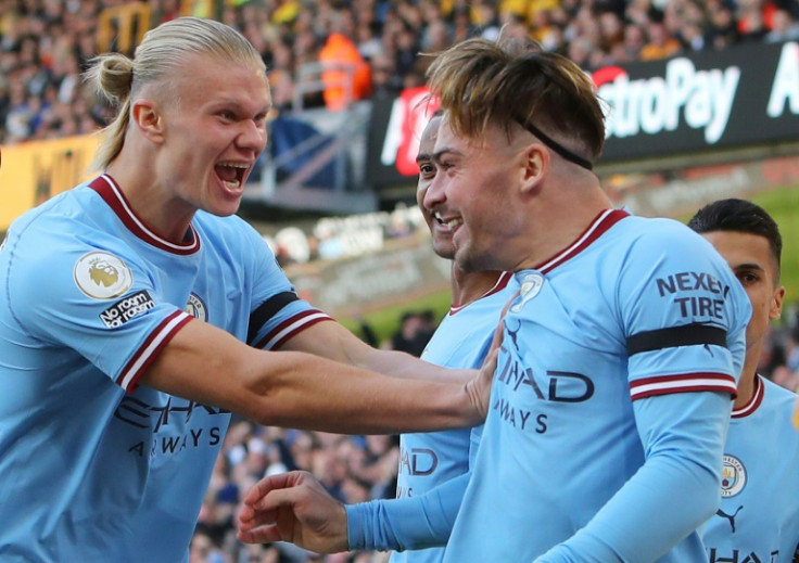 Manchester City's Erling Haaland (L) celebrates with Jack Grealish