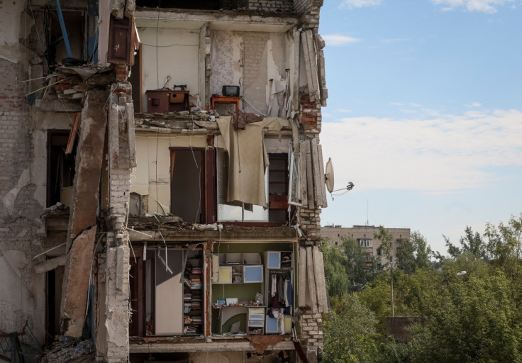A damaged apartment house is seen in the town of Izium