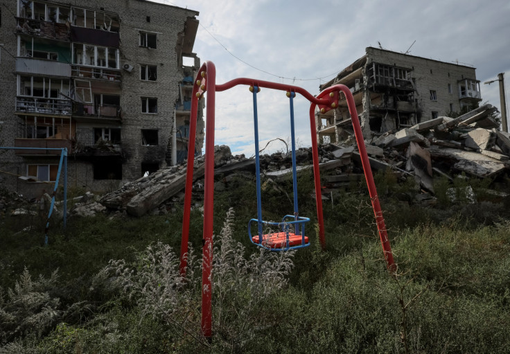 Damaged houses are seen in the town of Izium