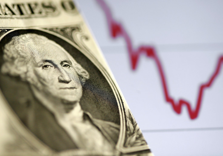 A U.S. dollar note is seen in front of a stock graph in this picture illustration