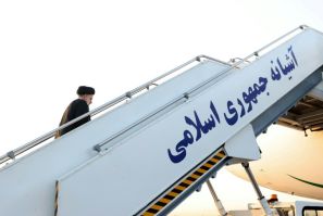 Iran's President Ebrahim Raisi climbs the stairs to his aircraft before departure from the capital Tehran's Mehrabad International Airport en route to the United Nations General Assembly