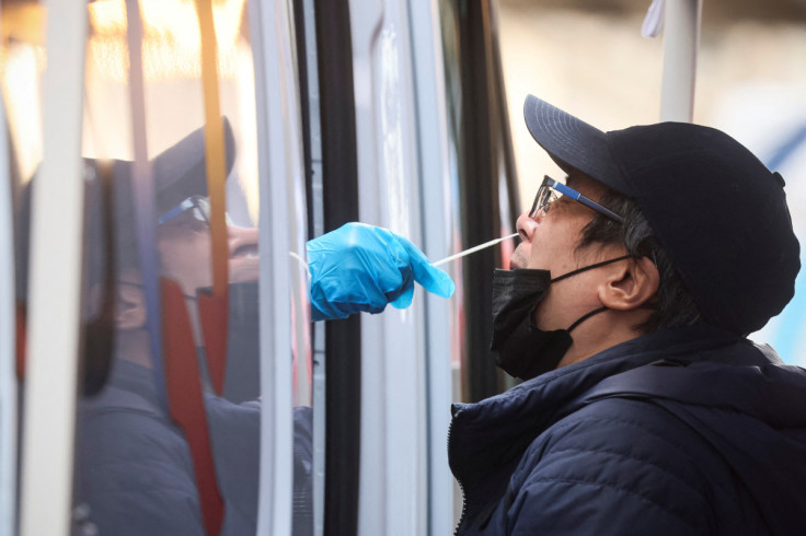 A man is given a coronavirus disease (COVID-19) test at pop-up testing site in New York