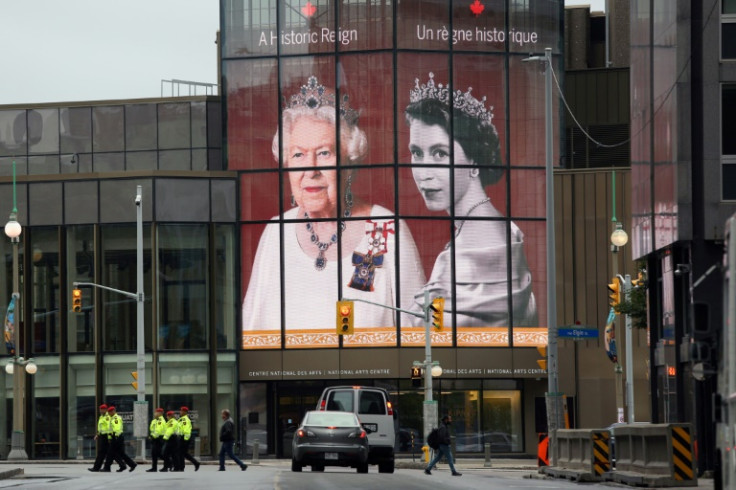 Portraits of Queen Elizabeth II are displayed at the National Arts centre in downtown Ottawa ahead of a memorial service for Britain's Queen Elizabeth II
