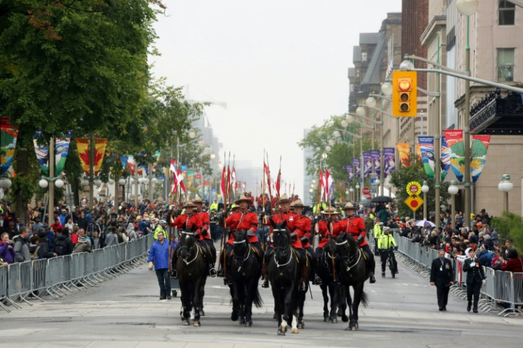 Royal Canadian Mounted Police Musical Ride leads a military parade in downtown Ottawa, Canada for a memorial service for Queen Elizabeth II