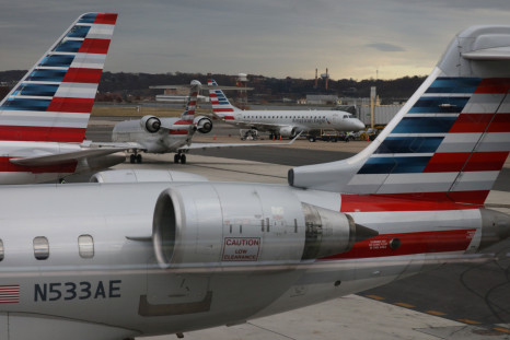 A jet from American Eagle, a regional branch of American Airlines (AA), taxis past other AA aircraft at Ronald Reagan Washington National Airport in Arlington