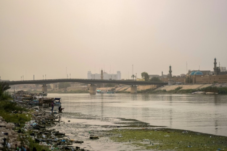 Thinning and polluted: the Tigris River flows under the Ahrar bridge in central Baghdad