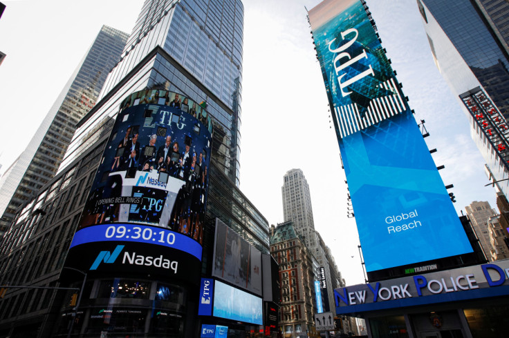 A screen announces the listing of private-equity firm TPG, during the IPO at the Nasdaq Market site in Times Square in New York