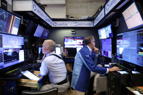Traders work on the trading floor at the New York Stock Exchange (NYSE) in Manhattan, New York City