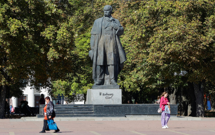 Pedestrians walk in Luhansk