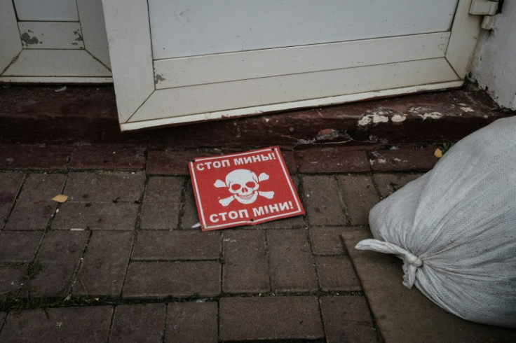 A mine sign outside the destroyed railway building at Kozacha Lopan, a retaken town in the eastern Ukrainian border region of Kharkiv