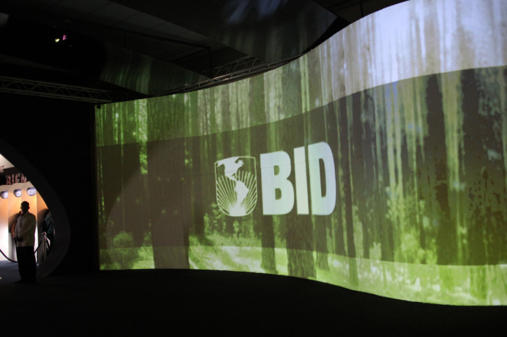 A man stands next to a screen with the logo of Banco Interamericano de Desarrollo (BID) at the Atlapa Convention Center in Panama City