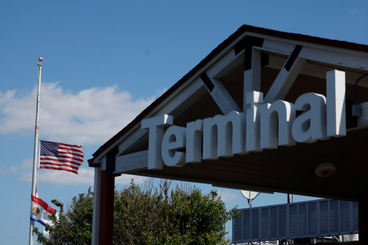 Migrants who have been flown from Texas via Florida arrive by plane at Delaware Coastal Airport