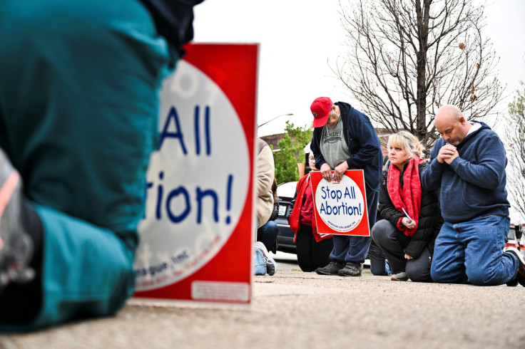 Anti-abortion protesters gather outside the EMW Women's Surgical Center in Louisville