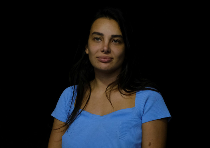 Interior designer Sali Hafiz, who is on the run from authorities after forcing a bank to release her family savings poses for a picture as she attends an interview with Reuters