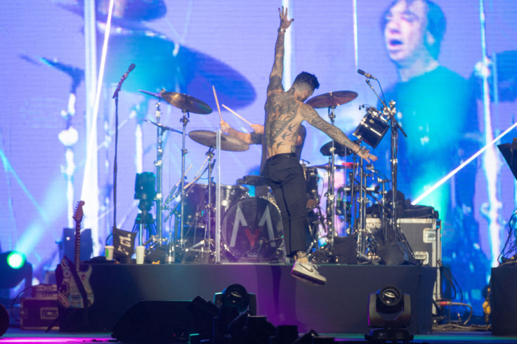 Adam Levine performing