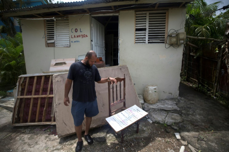 A man stands outside his house in the aftermath of Hurricane Fiona in El Seibo, Dominican Republic