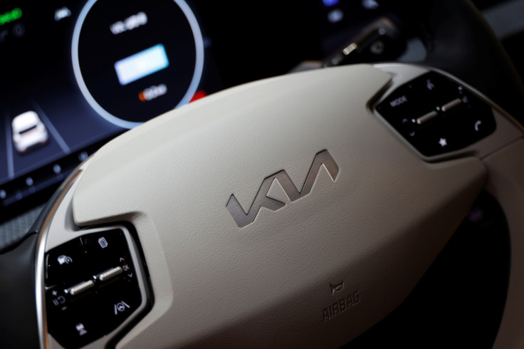 The logo of Kia Corp is seen on a steering wheel of its electric vehicle EV6 during a photo opportunity in Seoul