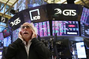 A trader reacts on the trading floor at the New York Stock Exchange (NYSE) in Manhattan, New York City