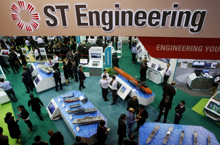 Visitors viewing the Singapore Technology (ST) Engineering booth at the Changi Exhibition Centre on the opening day of the Singapore Airshow