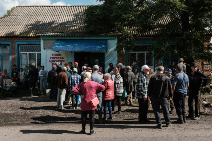 Neighbours helped the elderly get their food packages home