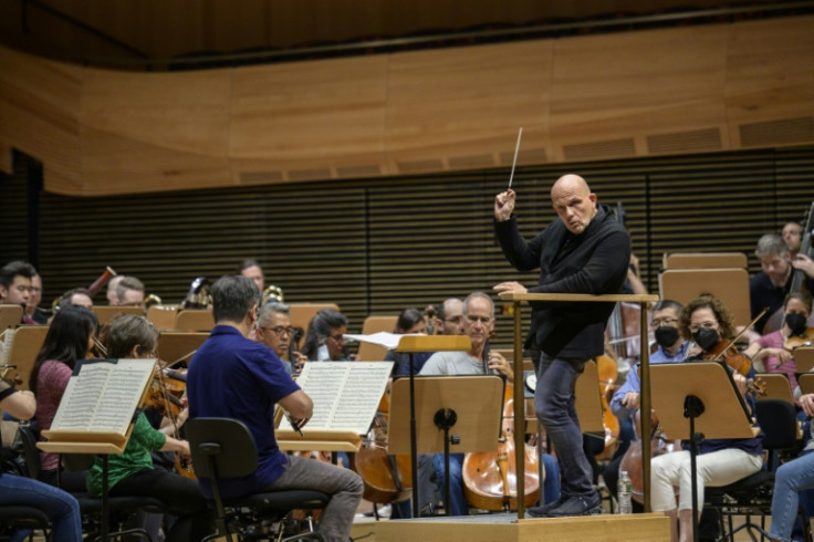 Dutch conductor Jaap van Zweden conducts the New York Philharmonic orchestra during a rehearsal at the symphony's new hall